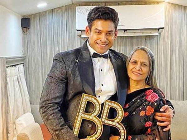 sidharth shukla posing with the bb trophy